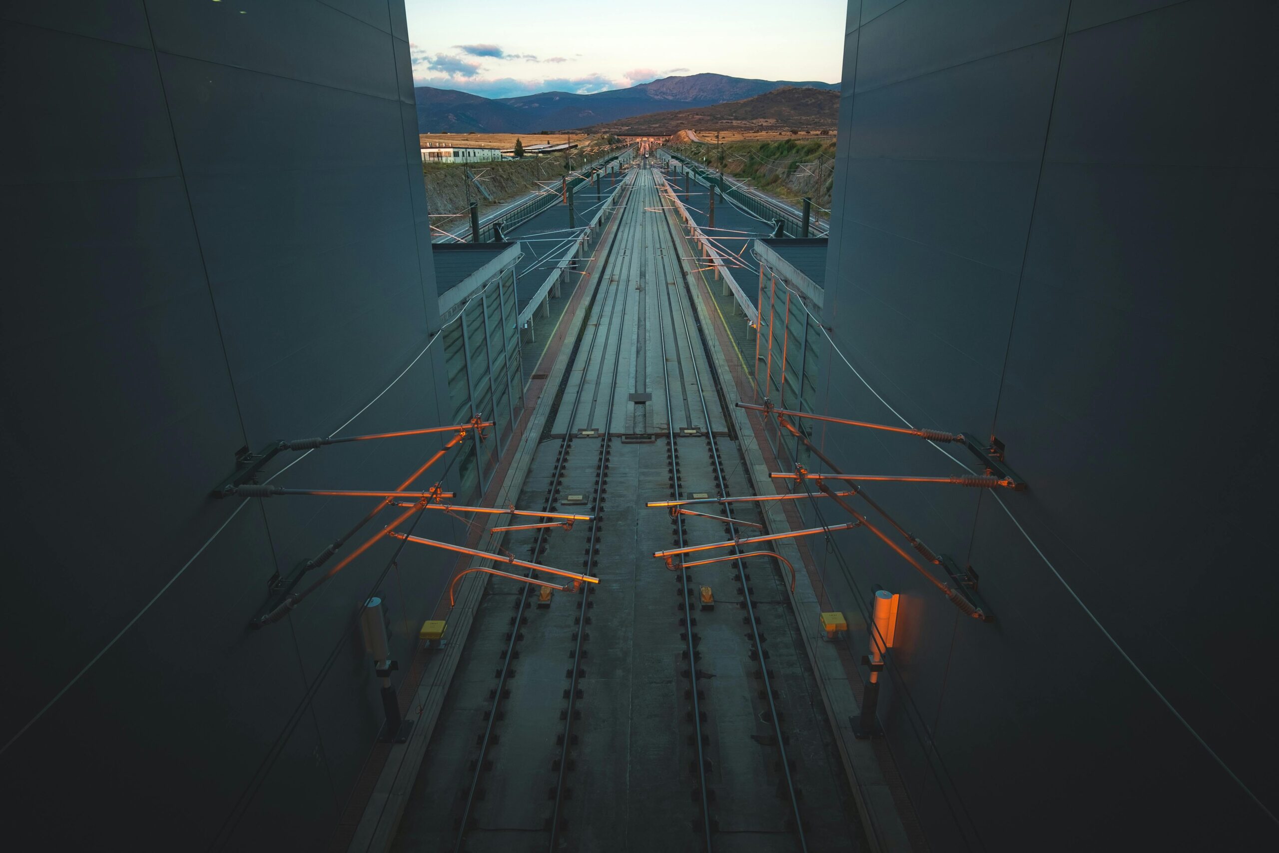 A captivating view of high-speed railway tracks in Segovia, Spain, highlighting modern transportation infrastructure.